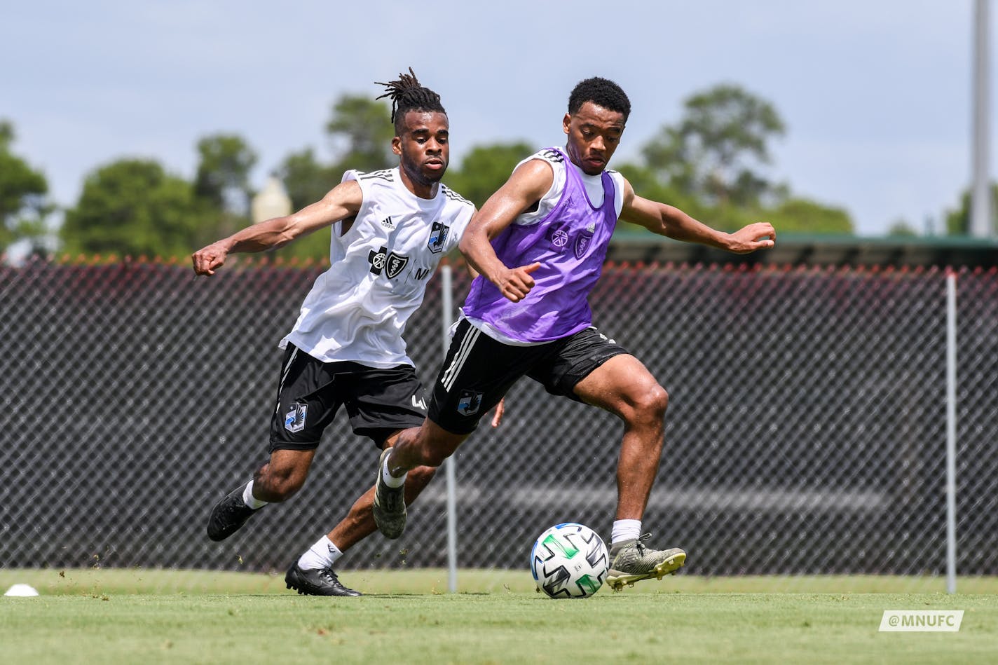 Jacori Hayes controlling the ball with Raheem Edwards defending from behind. Both are new midfielders acquired for this season. They're training at ESPN Wide World of Sports Complex at Walt Disney World in Orlando.