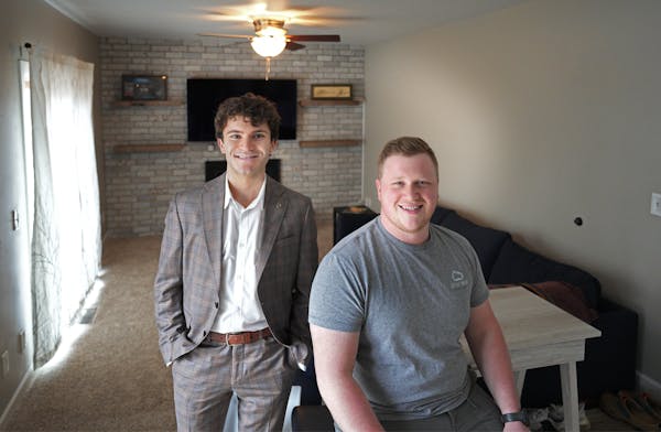 Realtor Issac Teplinsky and Grant Chelstrom in Chelstrom’s new home in Maple Grove.