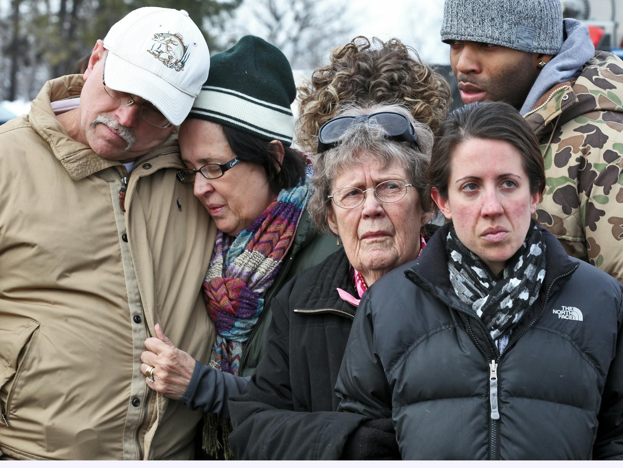 Family and friends of Danielle Jelinek, including parents Ed and Jan Jelinek, left, issued a plea for help to find the missing woman. Searchers combed an area near a lake in Chisago Lake Township on Wednesday. Jelinek lived in Oakdale with her sister, Cory Jelinek, right.