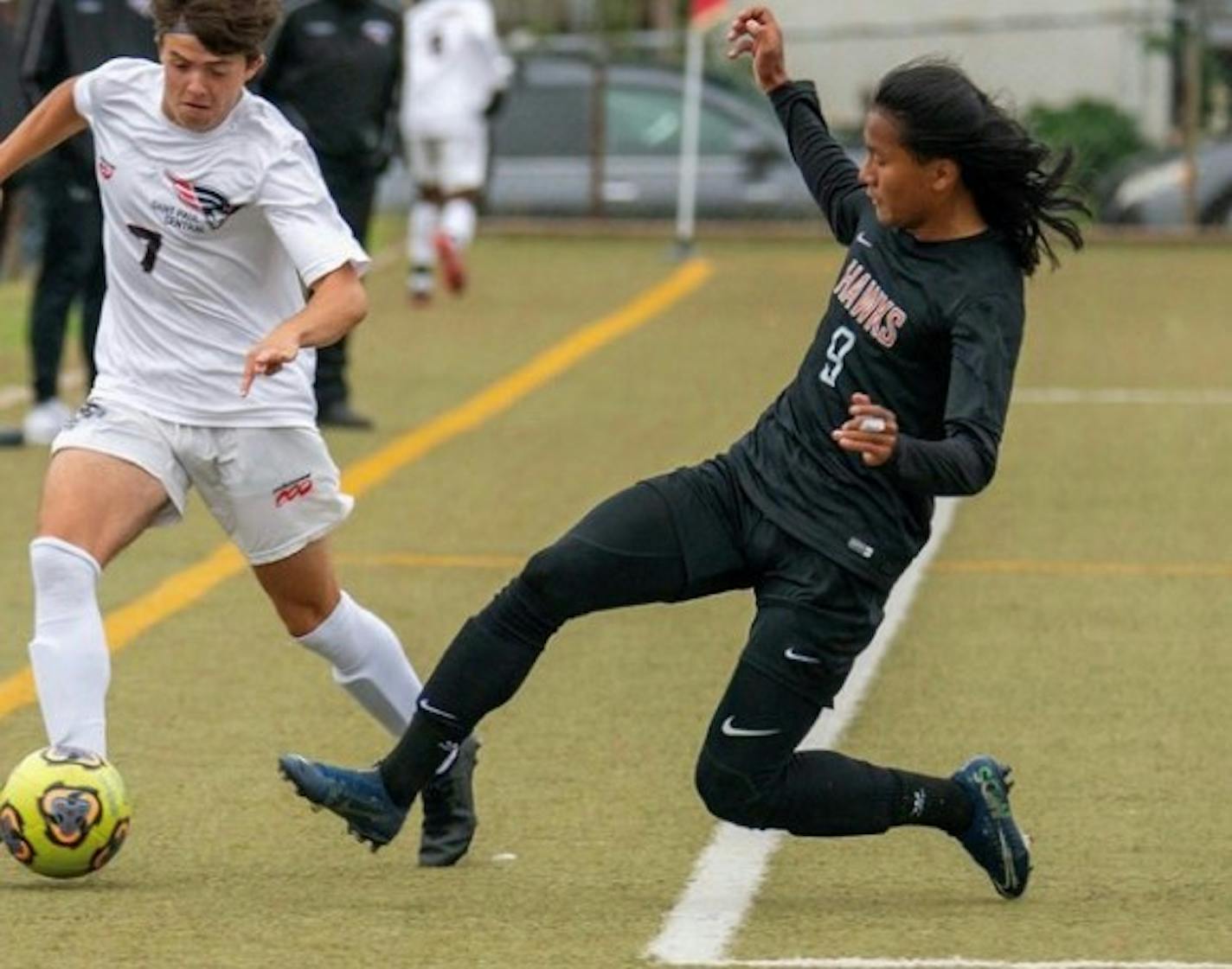 Yah Naing Oo, St. Paul Humboldt soccer, jr., 2020, in action in a game against rival St. Paul Central