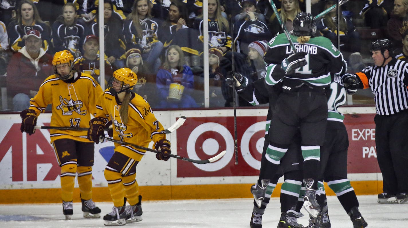 The Gophers womens hockey team's 62-game winning streak was on the line Sunday in a game against North Dakota. North Dakota led 3-0 after one period of play. North Dakota players celebrated after scoring a first period goal. (MARLIN LEVISON/STARTRIBUNE(mlevison@startribune.com)