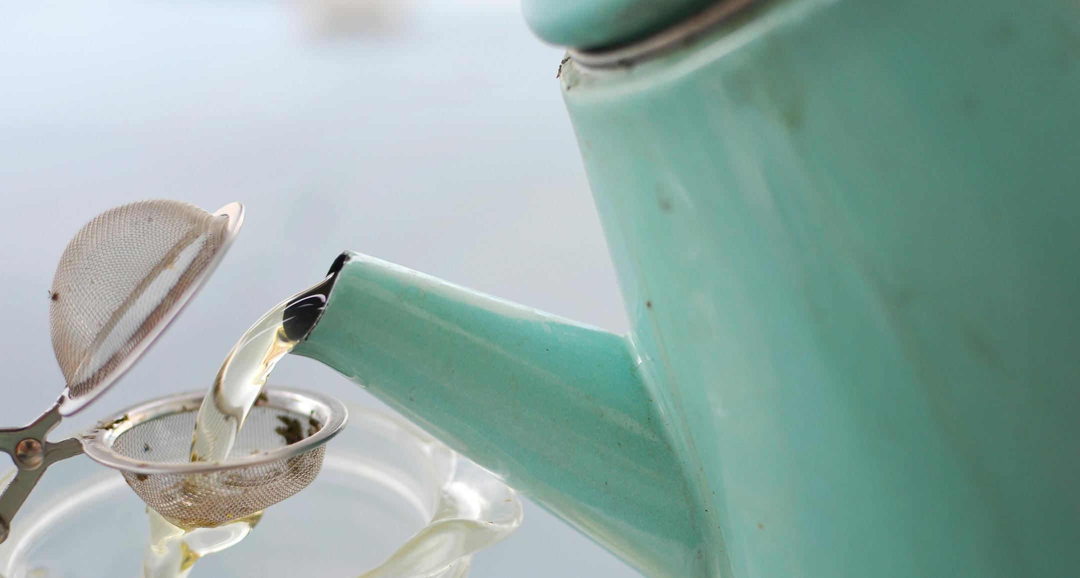 This photo provided by Amy Renea of A Nest for All Seasons shows tea being strained as hot water is poured from a kettle. This time of year, thereís nothing better than curling up with a hot cup of tea. Tea gardens are becoming a popular way for brew lovers to bypass the store and enjoy teaís benefits without additives or preservatives. (AP Photo/A Nest for All Seasons, Amy Renea)