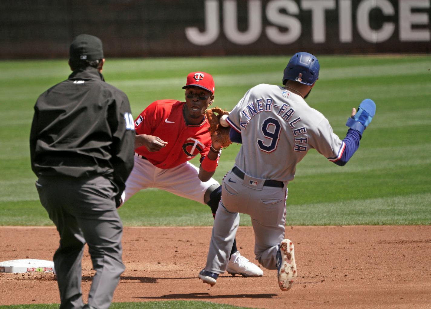 Twins second baseman Nick Gordon tags RangersIsiah Kiner-Falefa on a steal for the final out in the second inning.