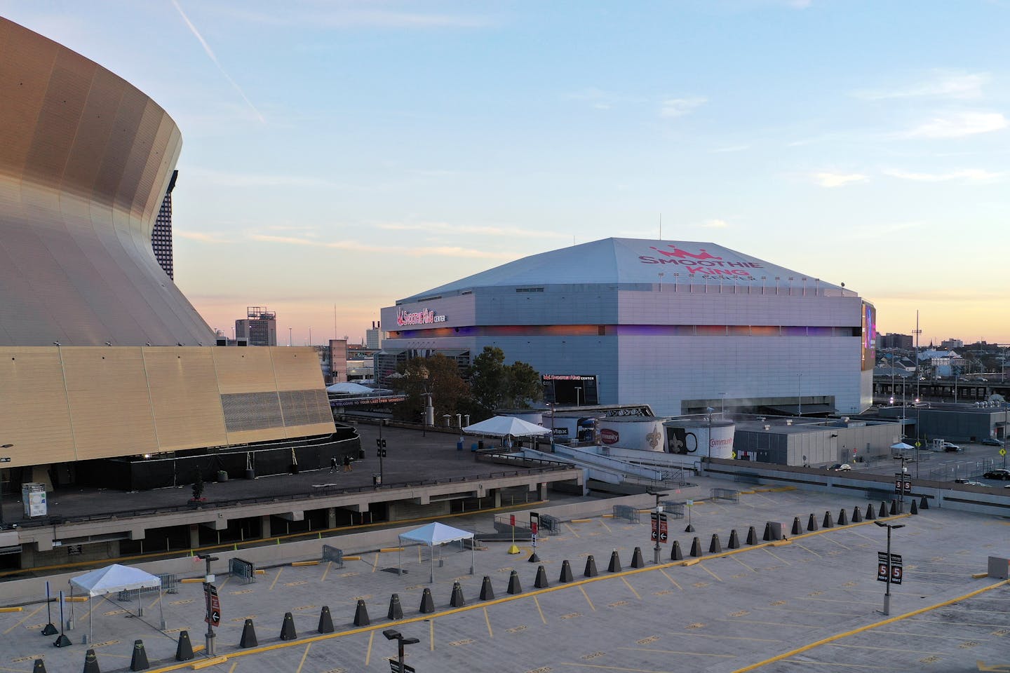 An aerial overall exterior view of Caesars Superdome and Smoothie King Center after an NFL football game between the New Orleans Saints and the Atlanta Falcons, Sunday, Dec. 18, 2022, in New Orleans. (AP Photo/Tyler Kaufman)