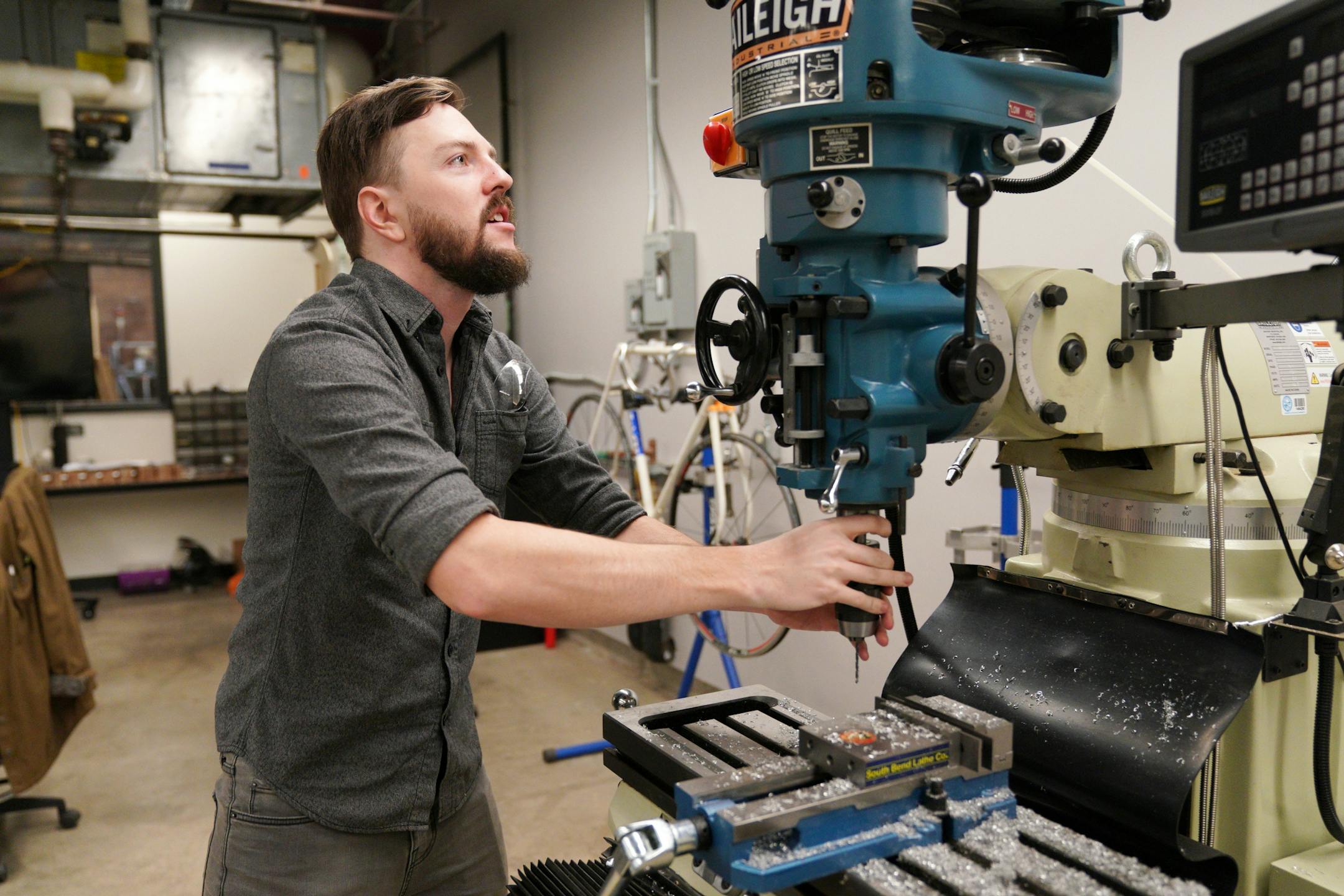 Course instructor Chase Spaulding, who moved from North Carolina to head the program, cleaned tools in the class workspace.