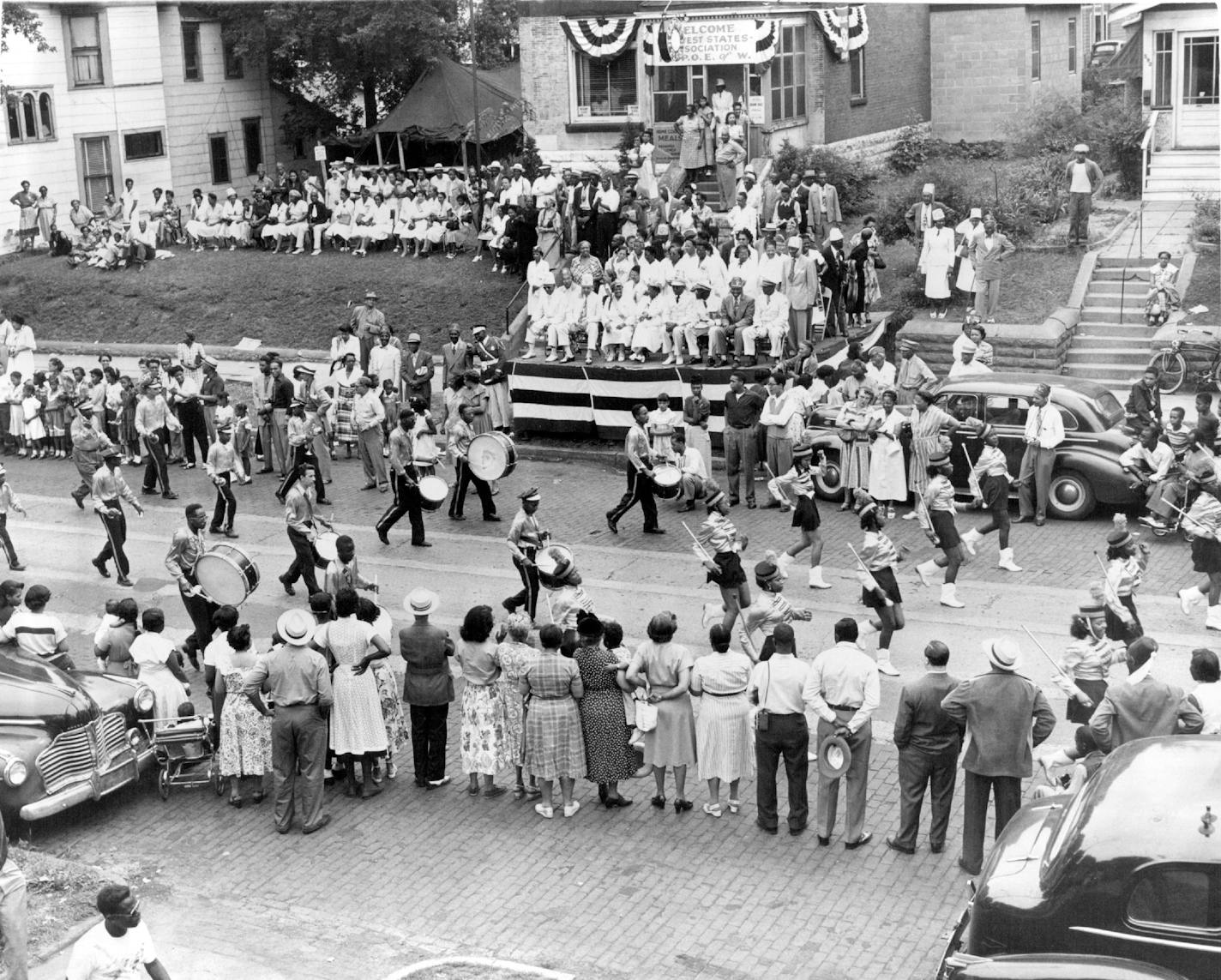 Monday, July 2, 1951. Ralph Bates Marching Club, Omaha, Nebraska. passing the reviewing stand at 588 Rondo Ave., St. Paul. Staff photo by Art Hager, Minneapolis Star Tribune. Delegates to the convention of the Midwestern Association of the Improved Benevolent Protective Order of Elks of the World paraded in St. Paul, Monday July 2, 1951. The convention will continue in St. Paul through Wednesday.