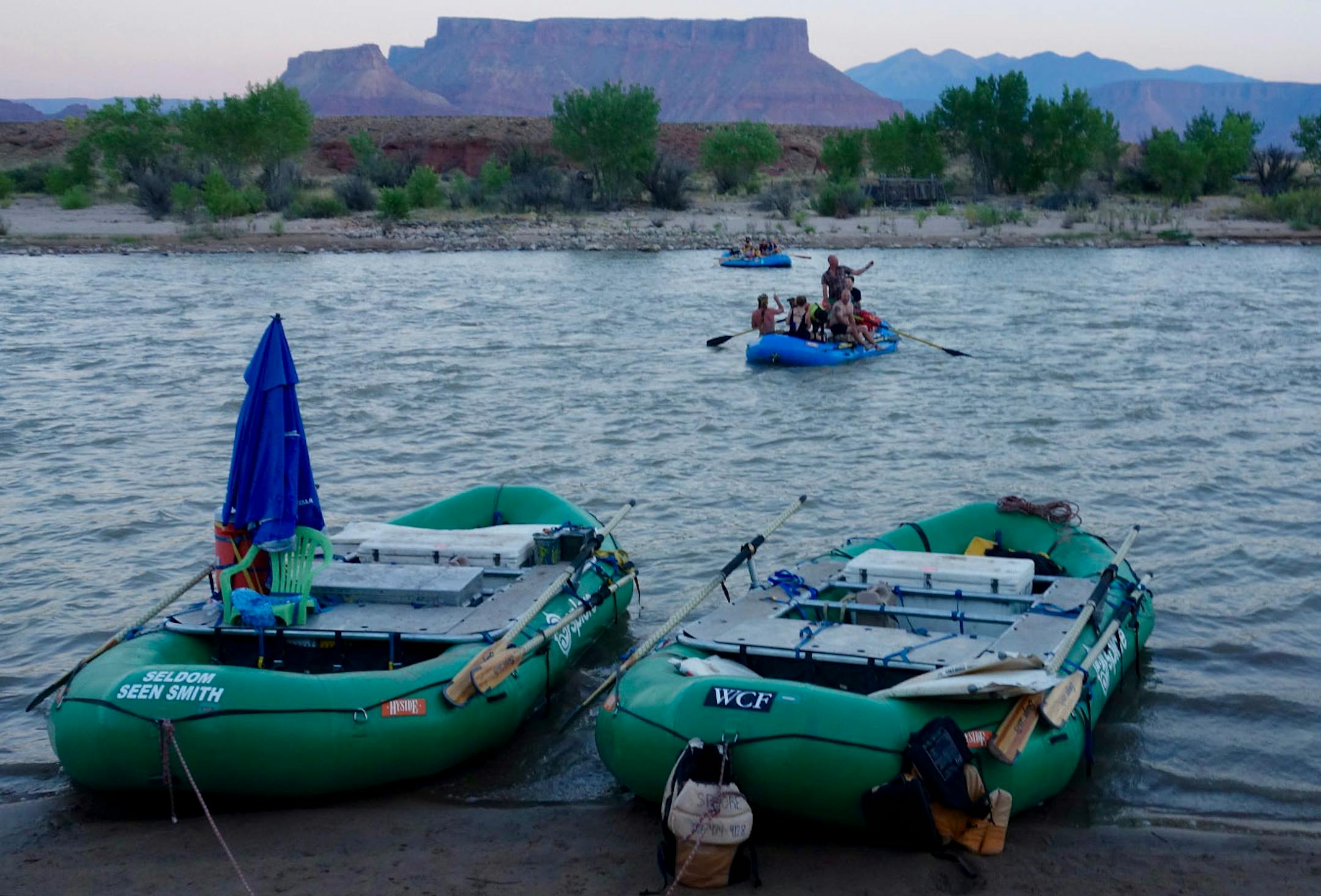 The remaining boat in our flotilla comes ashore at our river-side campground for the night.