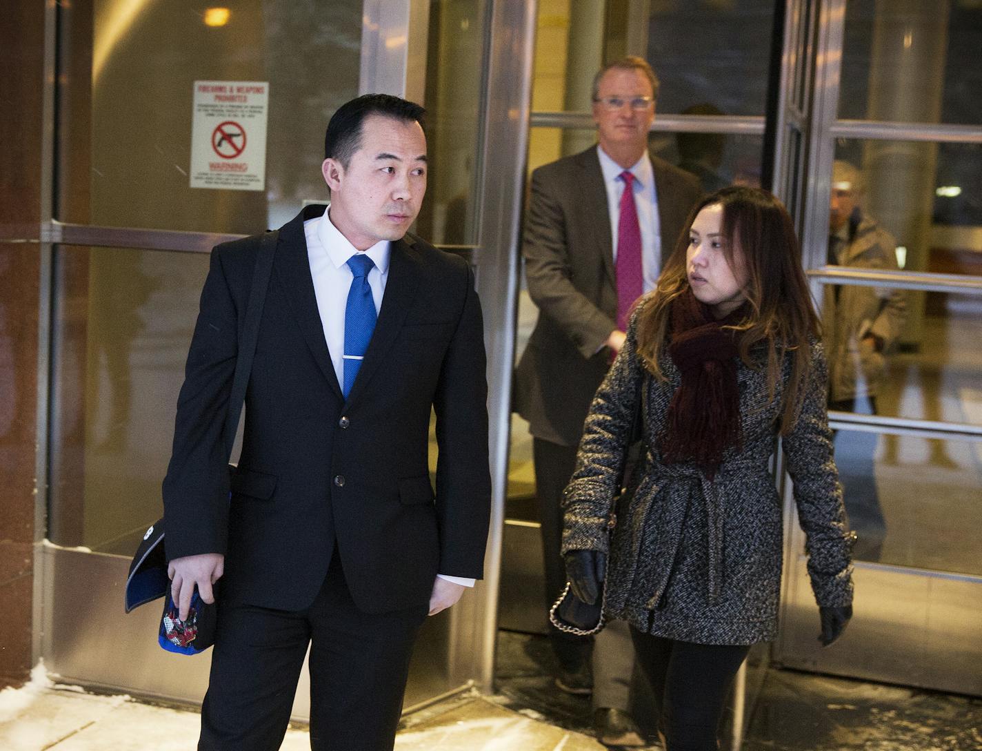 Koua Fong Lee, left, his wife Panghoua Moua and their attorney Bob Hilliard walk out of the Federal Courthouse in Minneapolis on Thursday, January 8, 2015. ] LEILA NAVIDI leila.navidi@startribune.com / BACKGROUND INFORMATION: A lawsuit against Toyota Corp. got underway in U.S. District Court in Minneapolis, with jurors asked to assess blame for a two-car accident that cost three people their lives and Koua Fong Lee's imprisonment for more than two years.