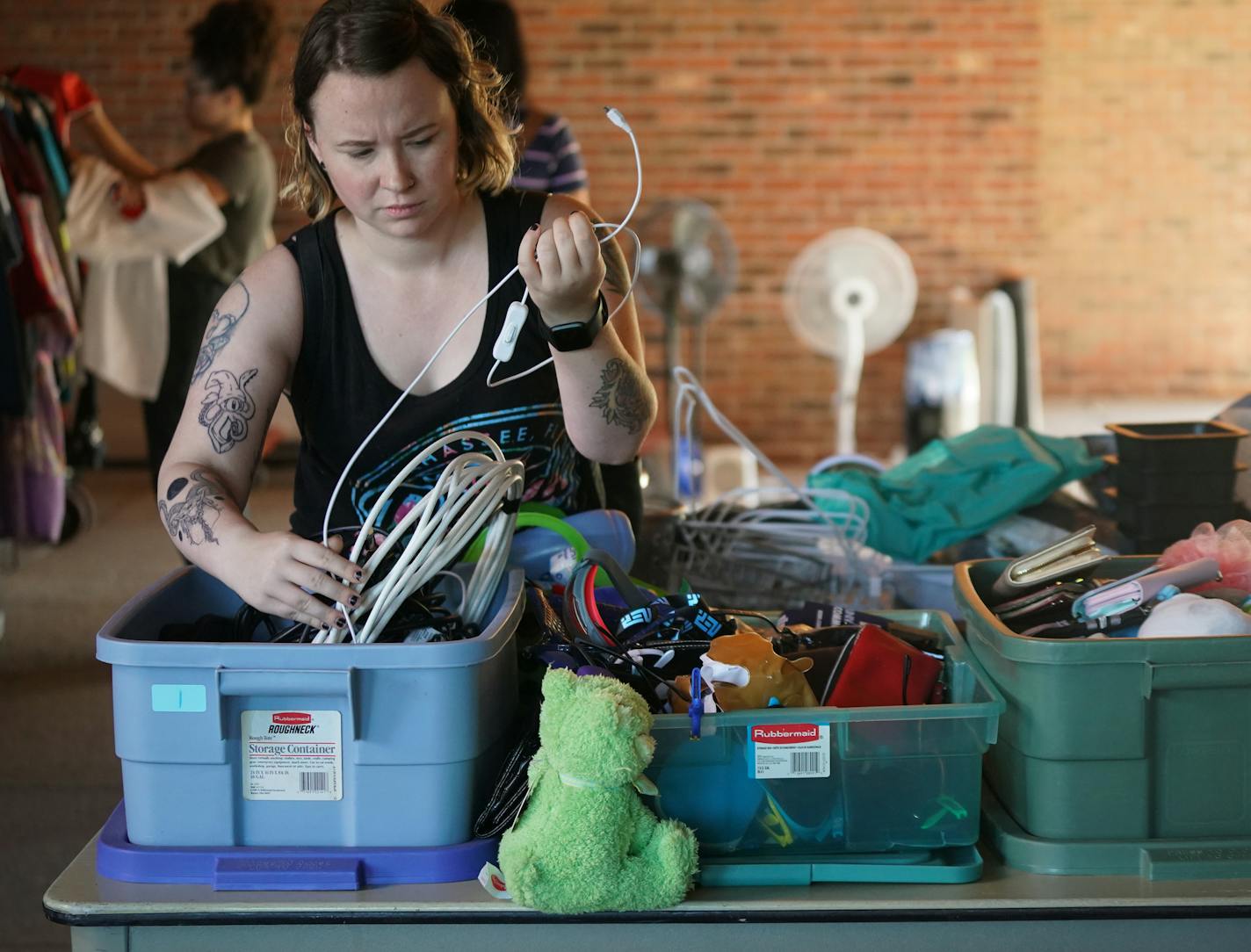 Hamline University senior Anissa Mench rifled through cords and cables during the school's "free store" event outside Bush Memorial Library.