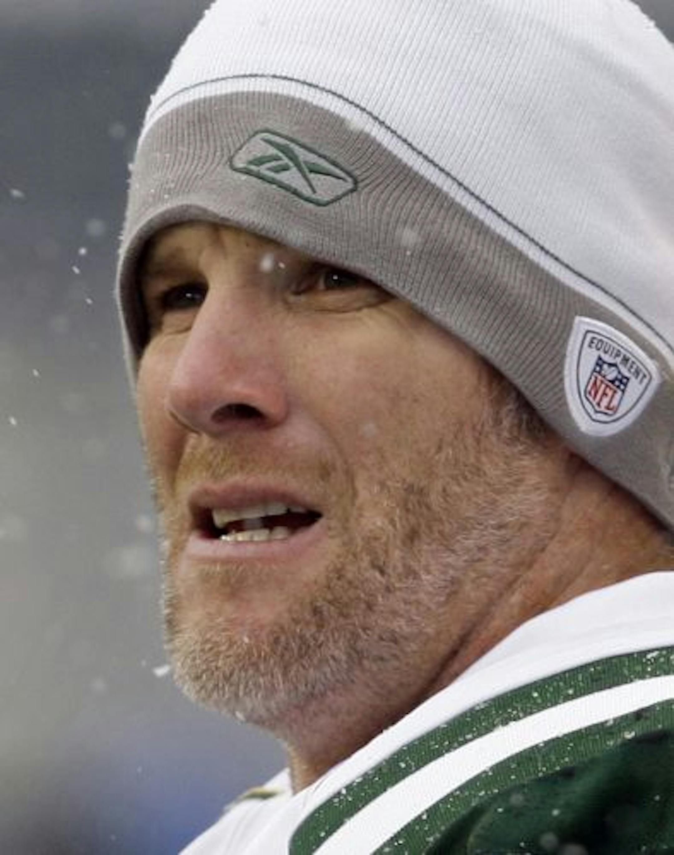 FILE - In this Dec. 21, 2008, file photo, New York Jets quarterback Brett Favre watches from the sidelines against the Seattle Seahawks in an NFL football game in Seattle. Minnesota Vikings coach Brad Childress said Tuesday, July 28, 2009, that Favre won't play for the Vikings.