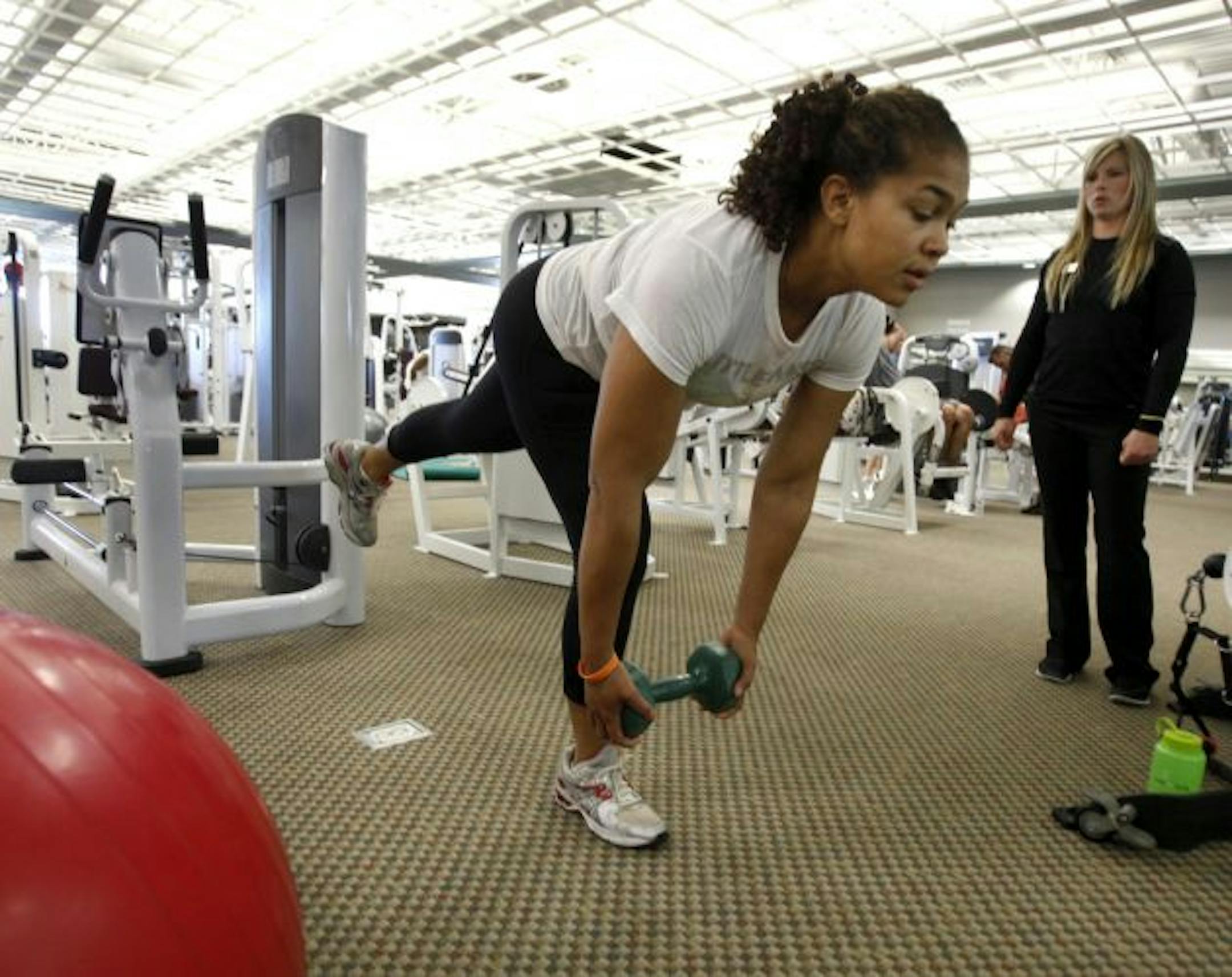 SunShine Hampton now gets up early to work out at Lifetime Fitness in Eagan under the supervision of personal trainer Tiffany Hoikka.