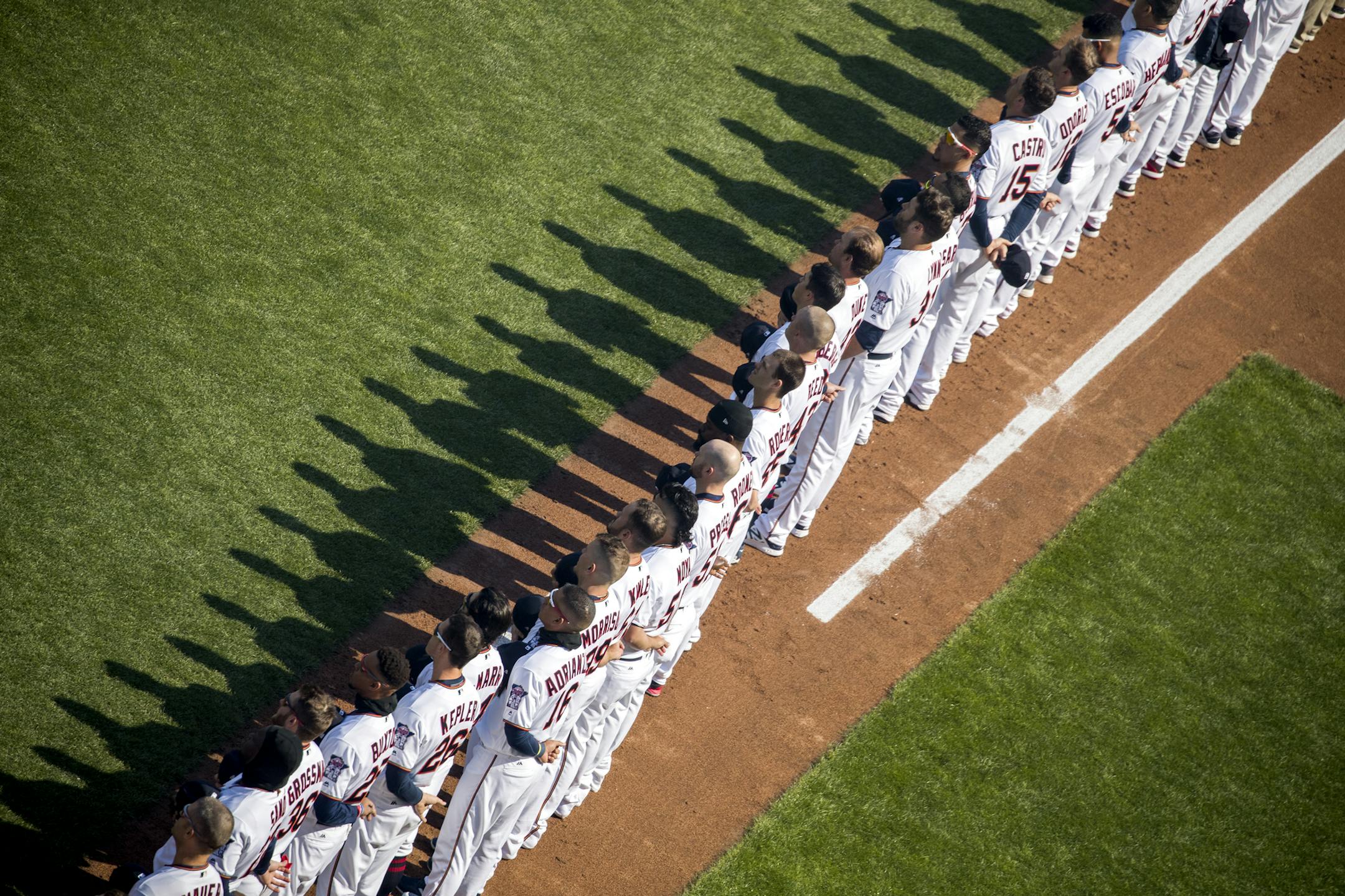 The Minnesota Twins line up for the National Anthem before the game. ] LEILA NAVIDI ï leila.navidi@startribune.com BACKGROUND INFORMATION: The Minnesota Twins home opener against the Seattle Mariners at Target Field in Minneapolis on Thursday, April 5, 2018.