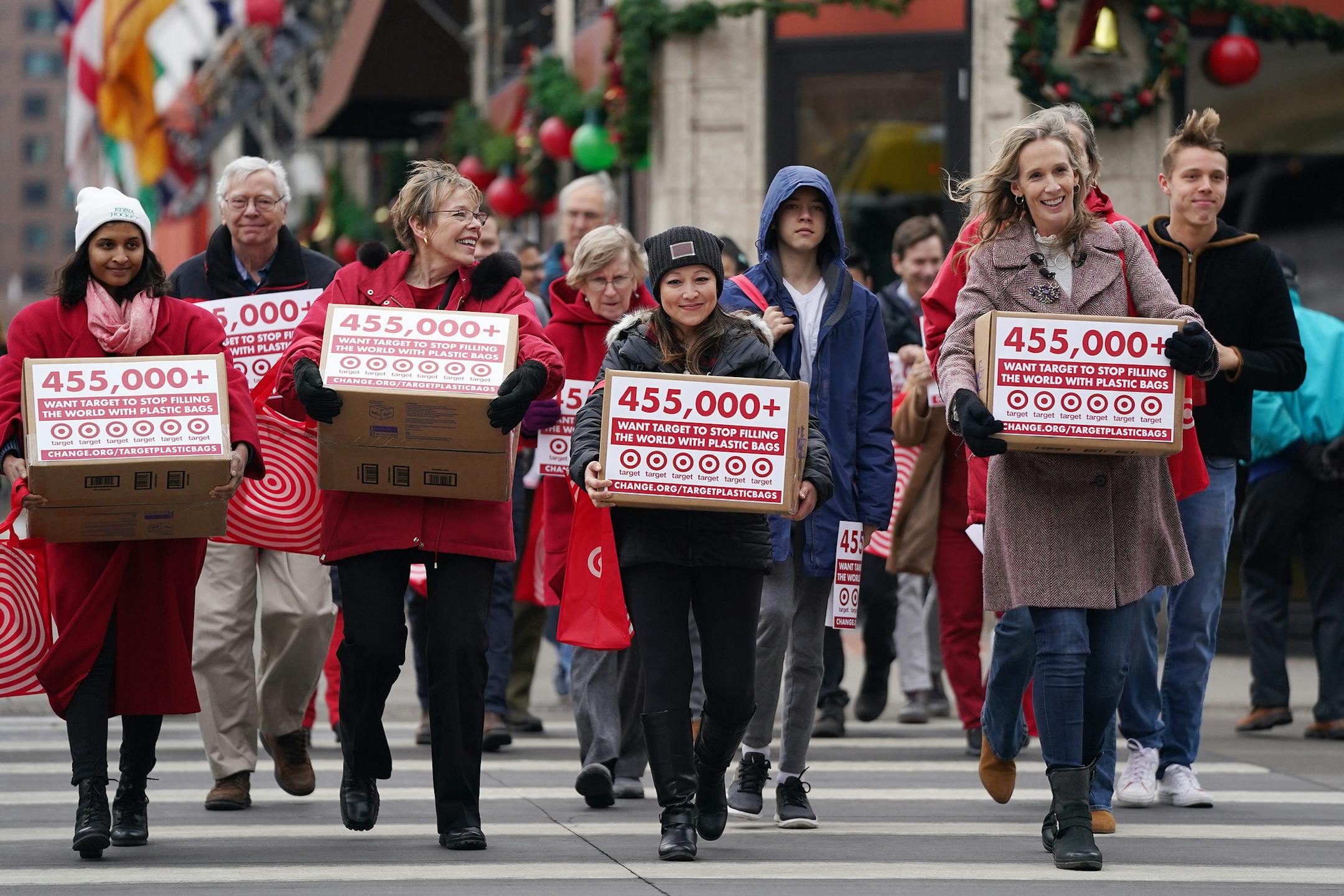 Theresa Carter, right, who started a petition on Change.org calling for the retail giant Target to end its use of plastic bags, along with supporters delivered her petitions on Thursday.