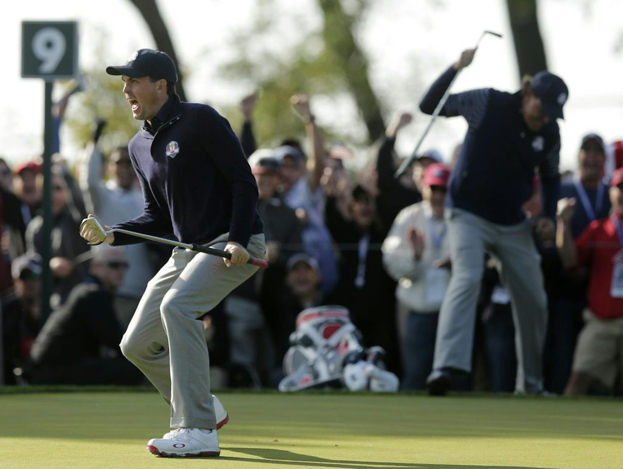 USA's Keegan Bradley reacts after making a putt on the ninth hole during a foursomes match at the Ryder Cup PGA golf tournament Saturday, Sept. 29, 2012, at the Medinah Country Club in Medinah, Ill.