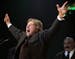 FILE - In this April 2, 2005 file photo, Wrestler Rowdy Roddy Piper gestures to the crowd after being inducted into the WWE Hall of Fame at the Induct