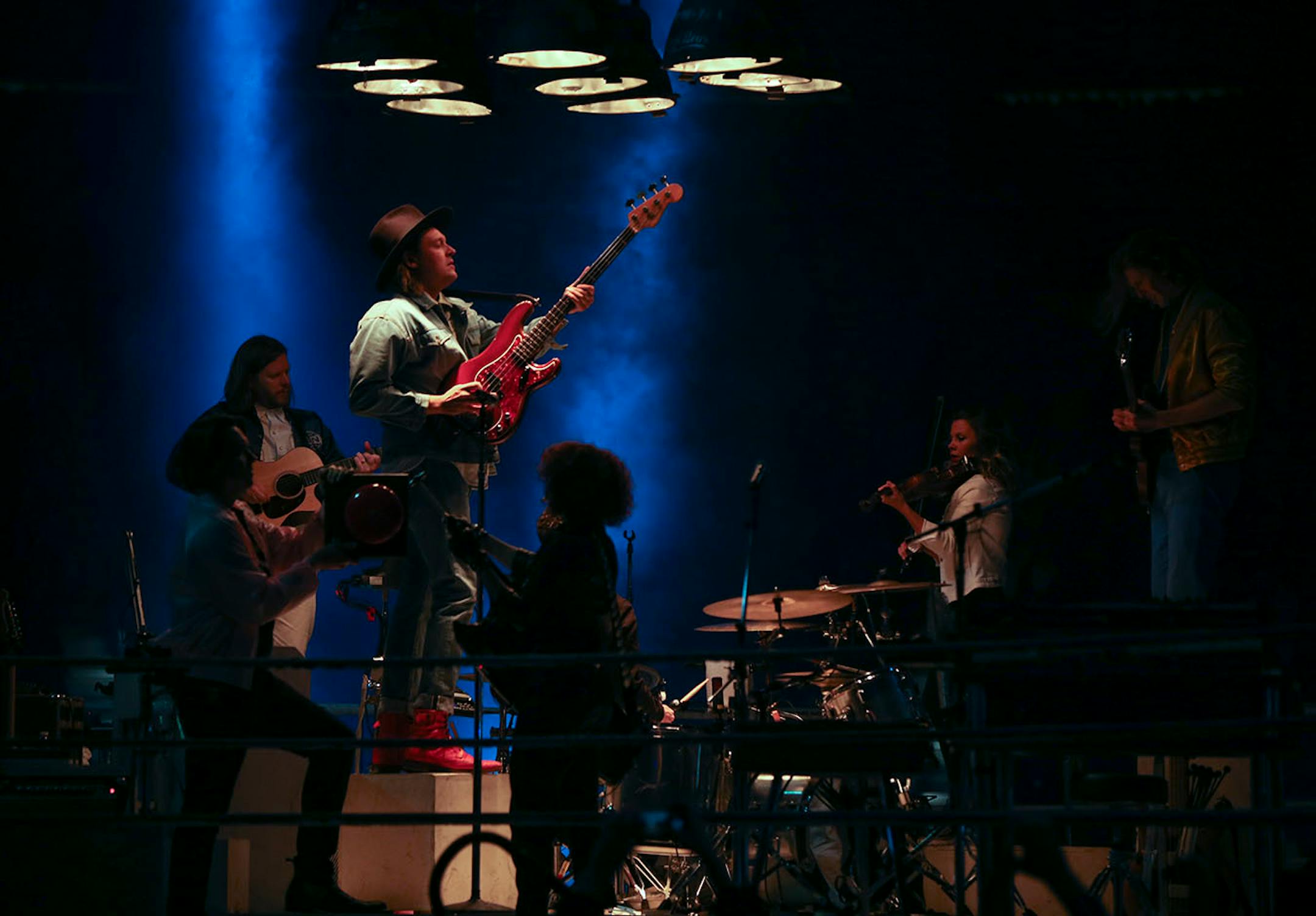 Arcade Fire began their show in a boxing ring in the center of the X.