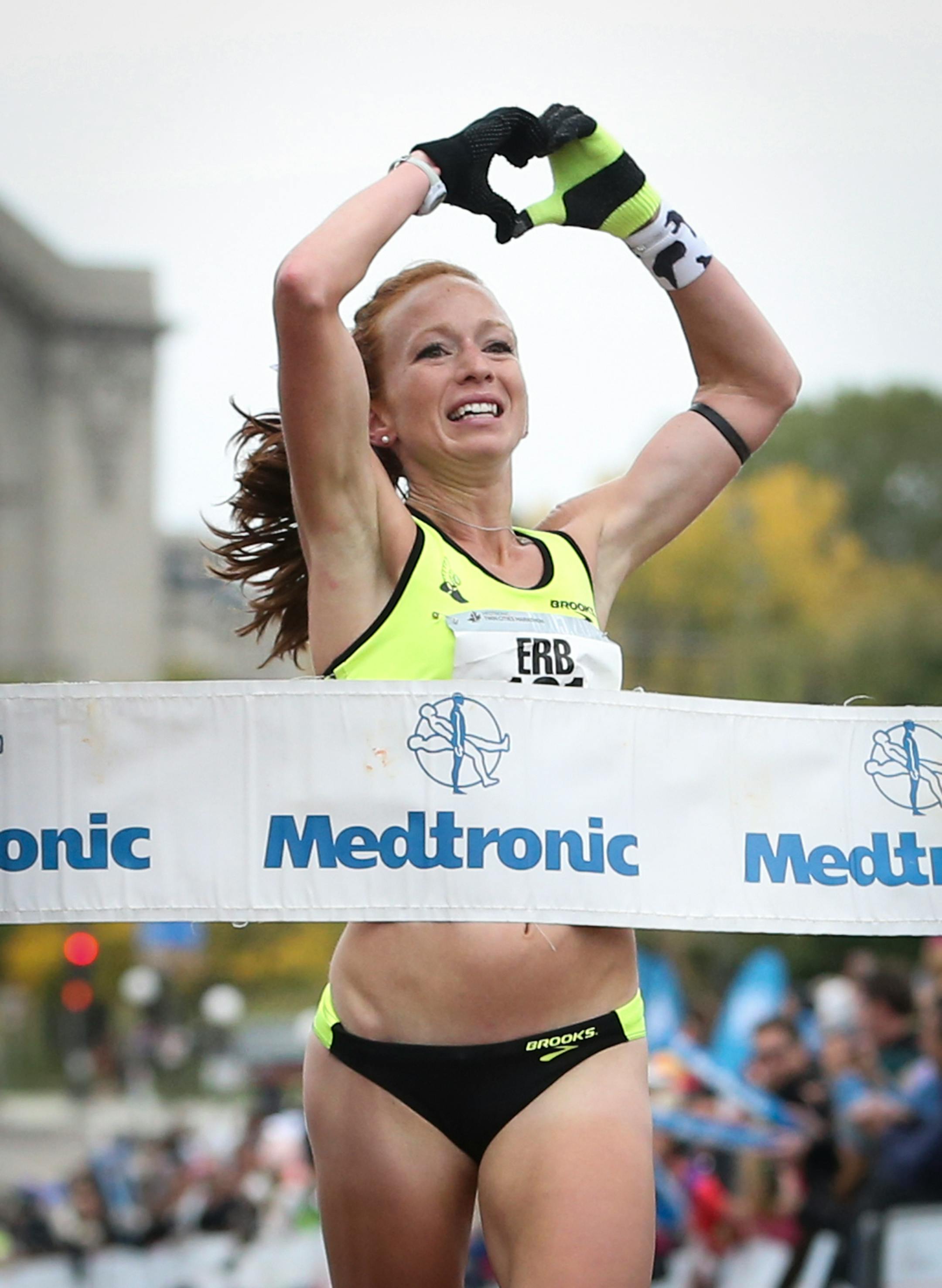 Esther Erb crossed the finish line to win the women's division of the Twin Cities Marathon on Sunday.