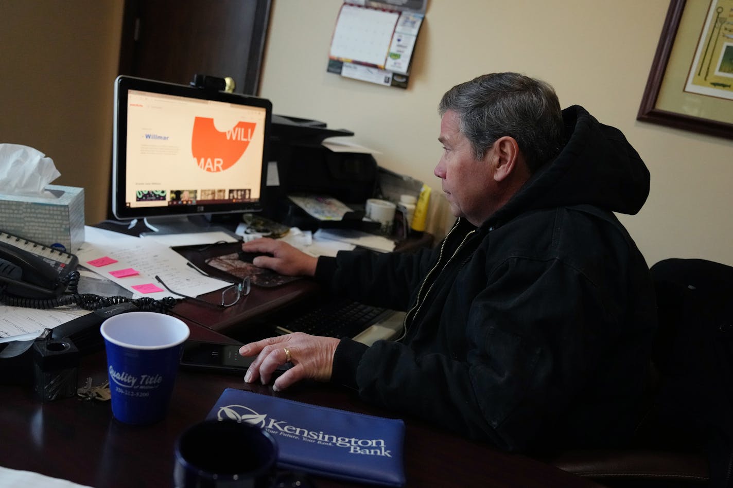 Realtor Tom Amberg, who owns Building 330, searches on his computer for information when informed by a Star Tribune reporter that his building's address was used by a subcontractor of Feeding Our Future where they claimed to feed 2,000 children a day out of the small office space, Thursday, Feb. 3, 2021 in downtown Willmar, Minn. ] ANTHONY SOUFFLE • anthony.souffle@startribune.com