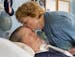 Joan Valor kisses her son, Eric Valor, 46, at their home in Aptos, Calif., on March 26. Eric was diagnosed with amyotrophic lateral sclerosis at age 3