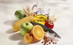 A beautiful group of products, (Fish, fruit, vegetables, cereals, beans, and olive oil) typical in the mediterranean diet