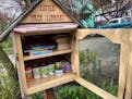 A Seattle Little Free Library is packed with useful things.