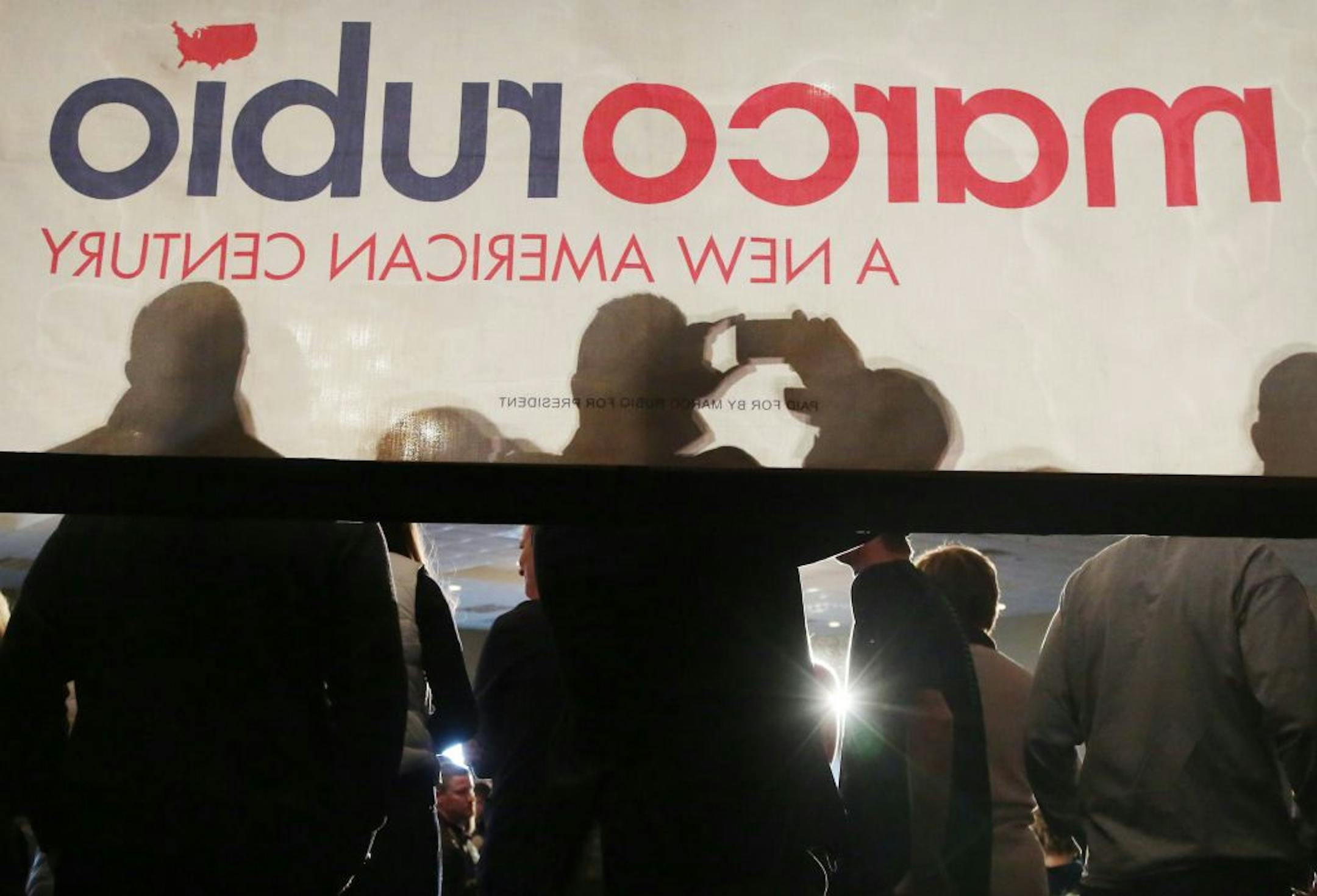 Seen from the back of a riser, a Senator Marco Rubio supporter takes a picture in advace of Senator Marcodelivering remarks and sharing his vision for A New American Century during his campaign visit Tuesday, March 1, 2016, at the Courtyards of Andover Events Center in Andover, MN.