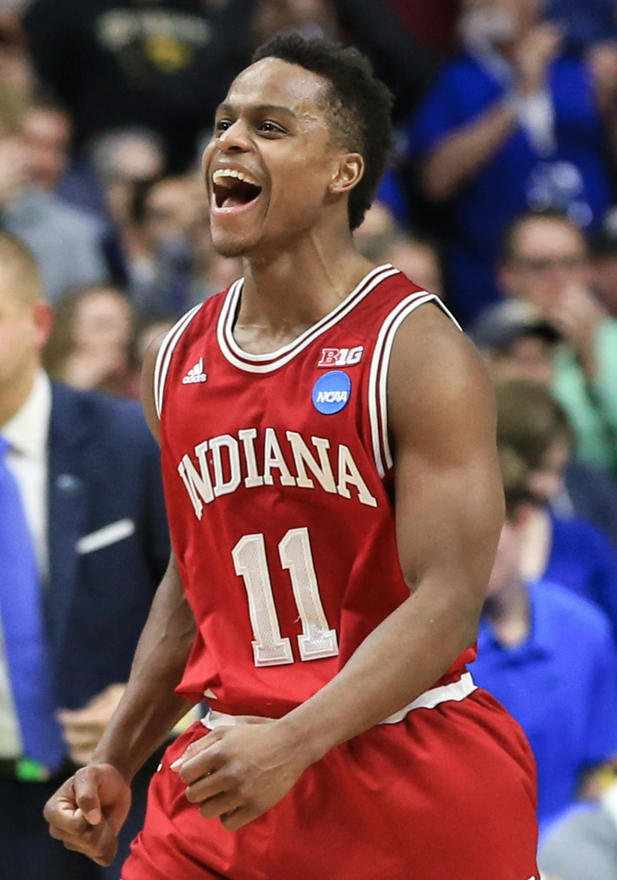 Indiana's Kevin Yogi Ferrell (11) celebrates the team's 73-67 win over Kentucky in a second-round men's college basketball game in the NCAA Tournament in Des Moines, Iowa, Saturday, March 19, 2016. (AP Photo/Nati Harnik)