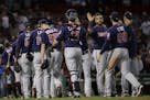 Minnesota Twins celebrate their 2-1 victory over the Boston Red Sox after a baseball game at Fenway Park, Thursday, Sept. 5, 2019, in Boston.
