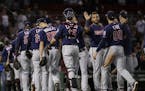 Minnesota Twins celebrate their 2-1 victory over the Boston Red Sox after a baseball game at Fenway Park, Thursday, Sept. 5, 2019, in Boston.