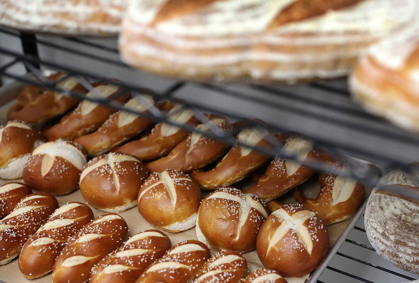 Pretzels, fresh from the oven, sat on racks. Joachim Berndt and his employees make about 1,200 pretzels a week, many headed for area breweries.