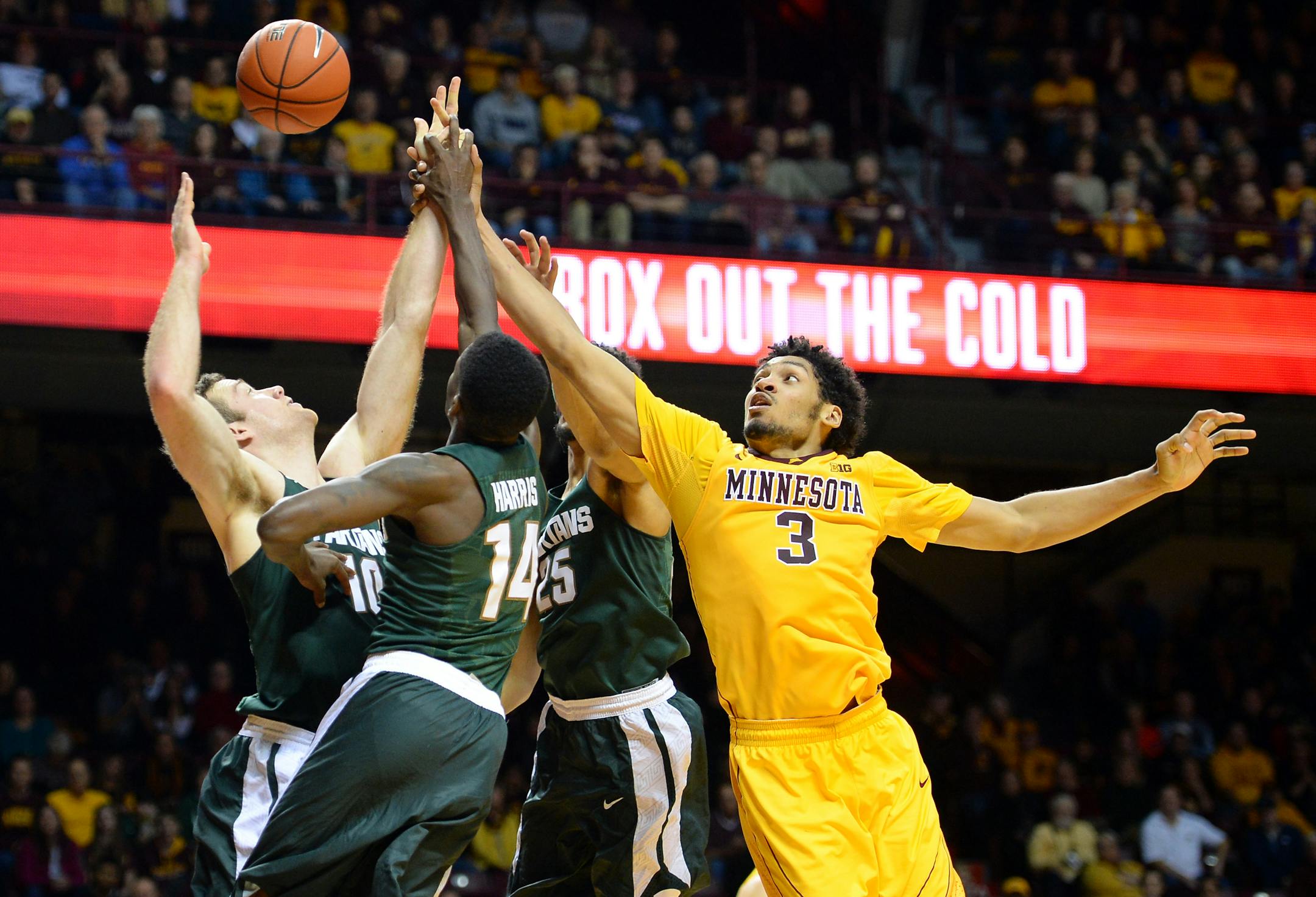 Minnesota Golden Gophers forward Jordan Murphy (3) was unable to get an offensive rebound while being challenged by a host of Michigan State Spartans defenders in the second half Saturday. ] (AARON LAVINSKY/STAR TRIBUNE) aaron.lavinsky@startribune.com The University of Minnesota Golden Gophers men's basketball team played the Michigan State Spartans on Saturday, Jan. 2, 2016 at Williams Arena in Minneapolis, Minn.