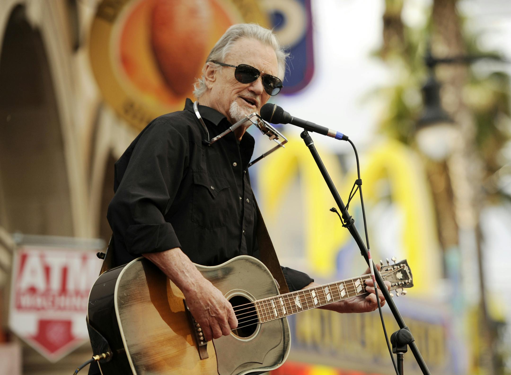 Kris Kristofferson performs the song "Me and Bobby McGee" at a ceremony honoring singer Janis Joplin with a posthumous star on the Hollywood Walk of Fame on Monday, Nov. 4, 2013 in Los Angeles. Kristofferson co-wrote the song with Joplin and Fred Foster. (Photo by Chris Pizzello/Invision/AP)