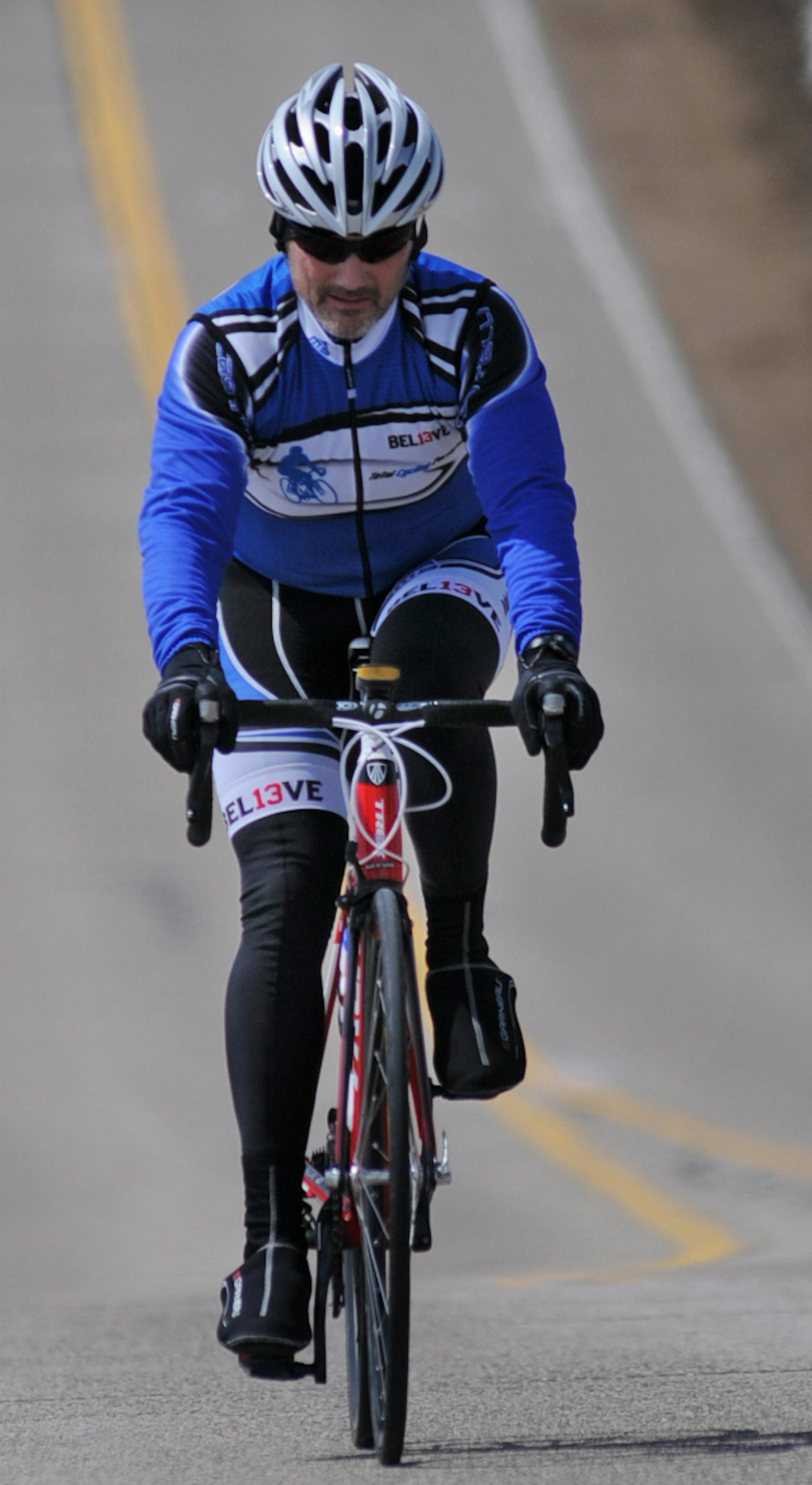 Bob McEnenany trained for the Iron Man bike event along Military Rd. in Woodbury and Maplewood.] Richard.Sennott@startribune.com Richard Sennott/Star Tribune. , Woodbury, Minn. Tuesday 4/16/13) ** (cq)