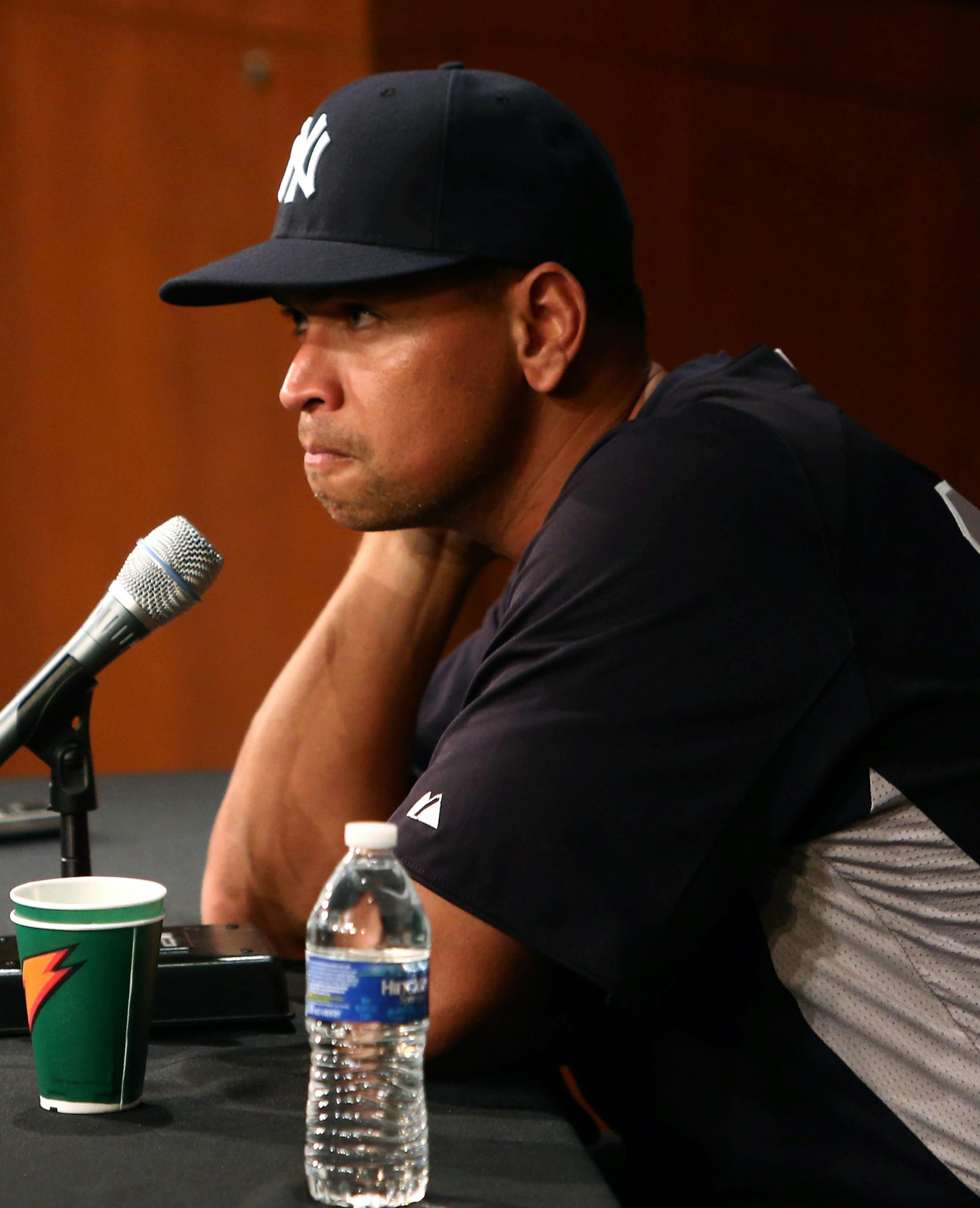 New York Yankees' Alex Rodriguez has a news conference before the Yankees play the Chicago White Sox in a baseball game at US Cellular Field in Chicago on Monday, Aug. 5, 2013. Rodriguez was suspended through 2014 and All-Stars Nelson Cruz, Jhonny Peralta and Everth Cabrera were banned 50 games apiece Monday when Major League Baseball disciplined 13 players in a drug case, the most sweeping punishment since the Black Sox scandal nearly a century ago. (AP Photo/Charles Cherney) ORG XMIT: CXC118