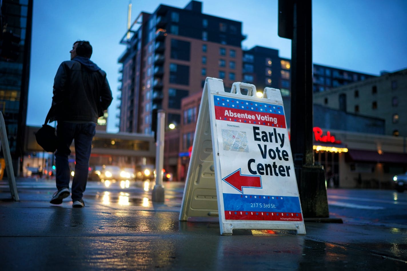 Voters lined up to vote early at the Minneapolis early voting center at 217 S. Third Street. Monday was the last day of early voting before Election Day. Workers took in the early voting signs at 5:00 pm but those already in line were allowed to vote.