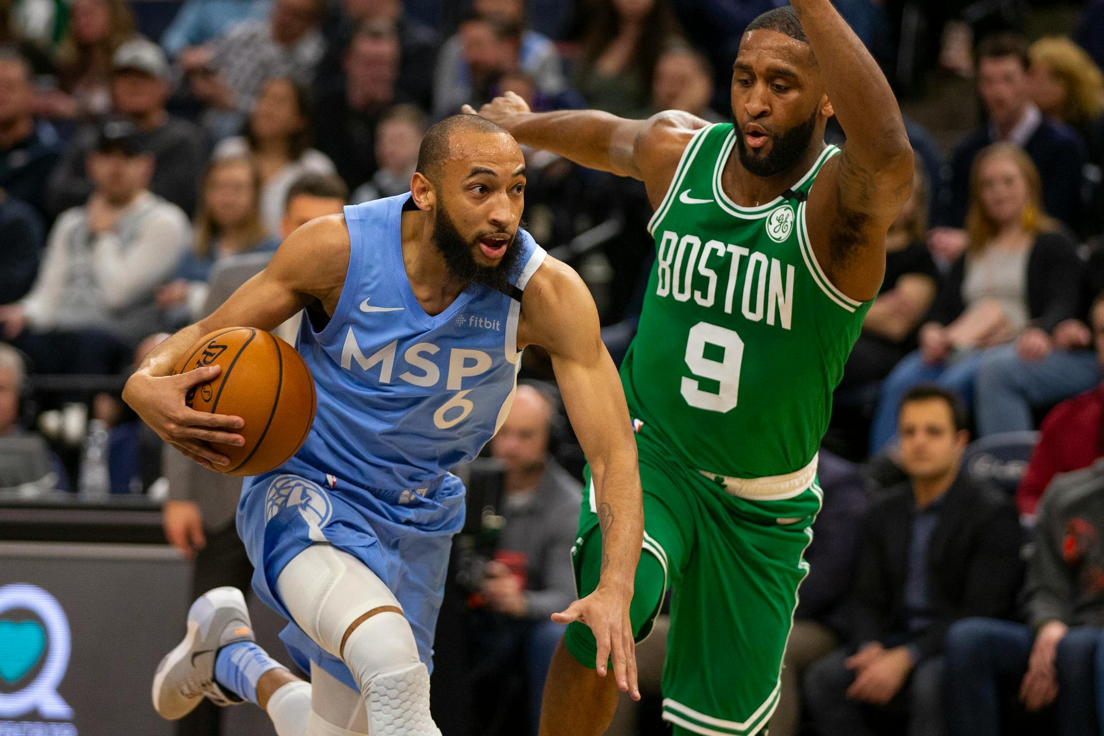 Point guard Jordan McLaughlin (6) has proven effective in teaching new players the Wolves' offensive style of play.