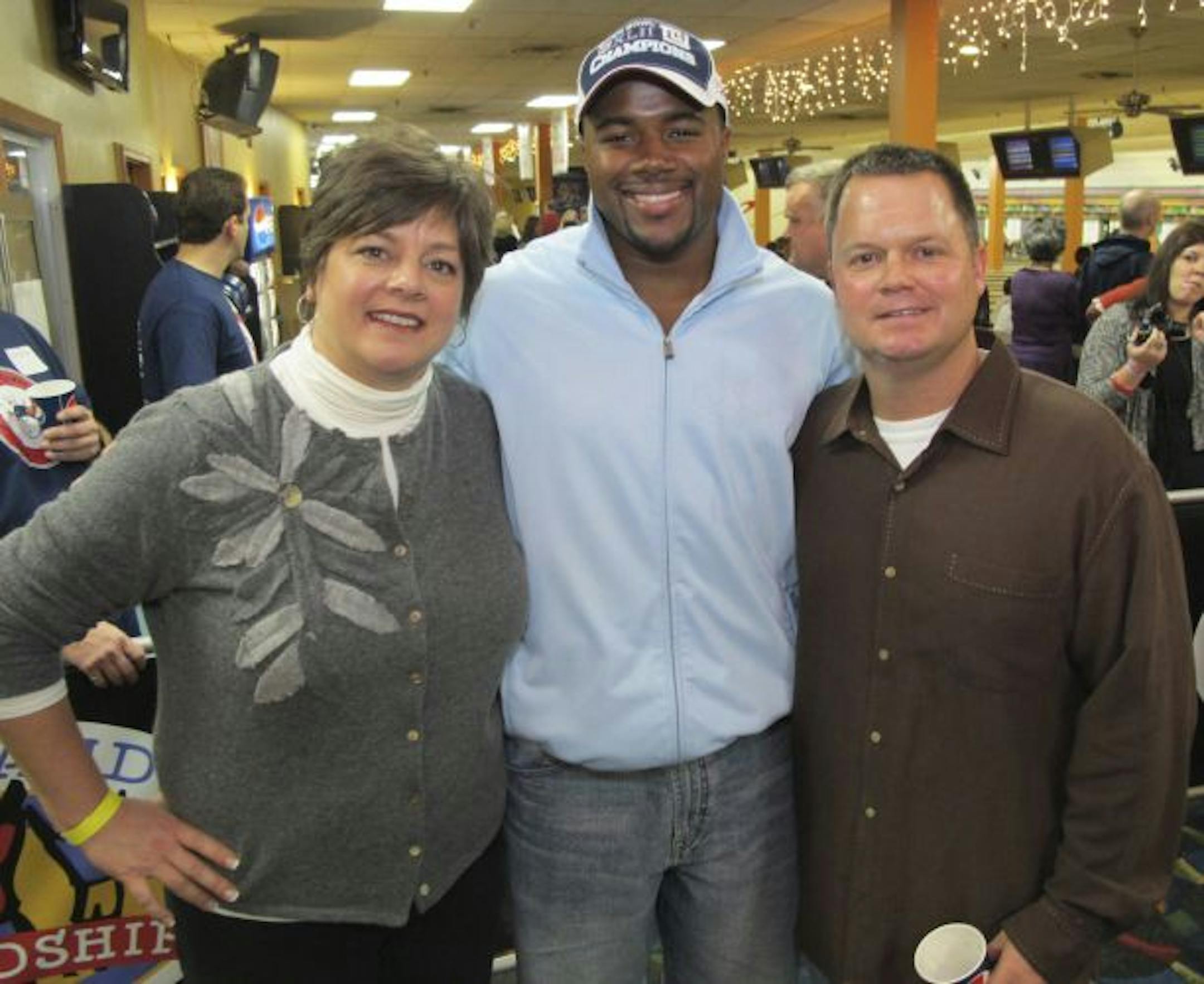 Judy Gallagher, former NFL player Marcus Freeman and Joe Gallagher.