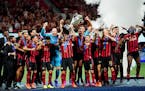 Atlanta United celebrates defeating Minnesota United 2-0 in the U.S. Open Cup at Mercedes-Benz Stadium in Atlanta on Tuesday, Aug. 27, 2019. Photo by 