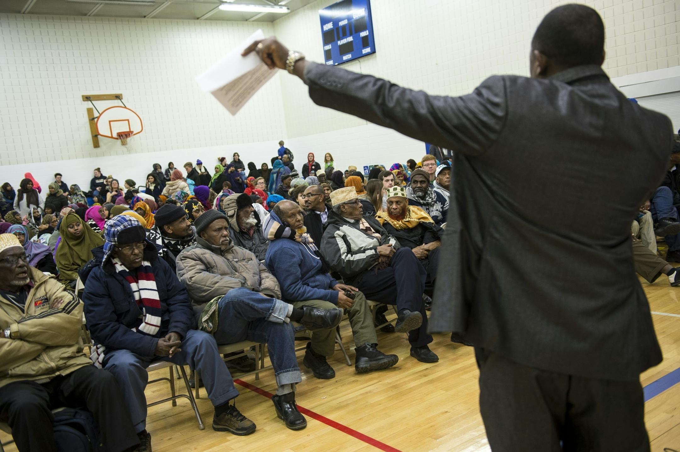 An Oromo translator addressed the crowd at Tuesday night's DFL caucus at the Brian Coyle Center in Minneapolis.
