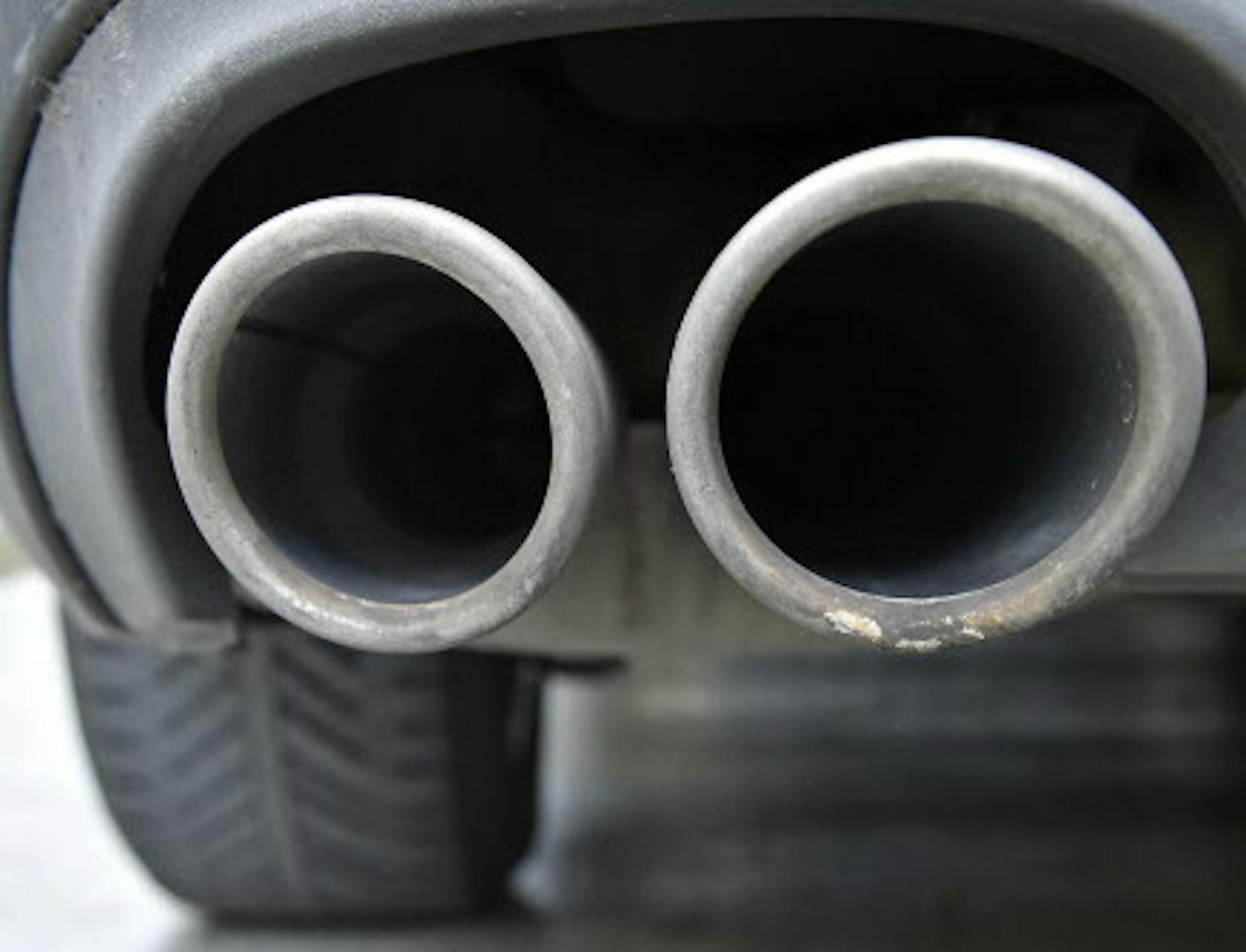 The exhaust pipes of an up to date Audi car blow out not visible emissions during the engine start in Gelsenkirchen, Germany, Wednesday, Nov. 4, 2015. Volkswagen said Tuesday that an internal investigation has revealed "unexplained inconsistencies" in the carbon dioxide emissions from 800,000 of its vehicles. (AP Photo/Martin Meissner) ORG XMIT: MME104