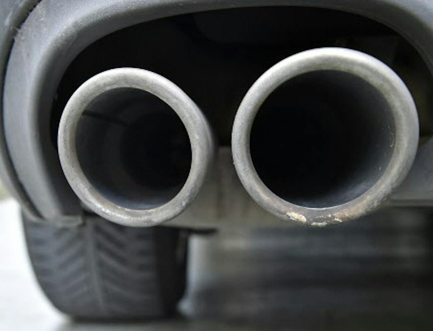 The exhaust pipes of an up to date Audi car blow out not visible emissions during the engine start in Gelsenkirchen, Germany, Wednesday, Nov. 4, 2015. Volkswagen said Tuesday that an internal investigation has revealed "unexplained inconsistencies" in the carbon dioxide emissions from 800,000 of its vehicles. (AP Photo/Martin Meissner) ORG XMIT: MME104