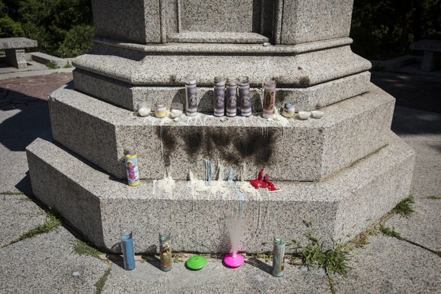 Candles sit at a monument at a park along the Mississippi River at the corner of Summit Avenue and East River Road in honor of Lavauntai Broadbent who St. Paul police say was shot by an armed victim when Lavauntai allegedly approached to rob on Friday in St. Paul, Minn. Photograph taken on Monday, August 3, 2015.