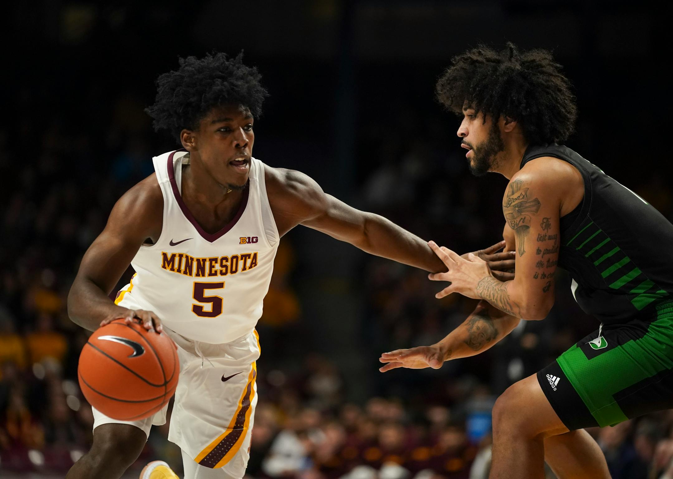 Gophers guard Marcus Carr drove against North Dakota guard Marlon Stewart in the first half of Minnesota's 79-56 victory at Williams Arena on Sunday night.