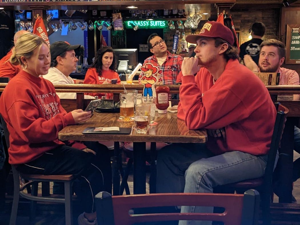 Nebraska fans wore their red at Lyon’s Pub in Minneapolis on Saturday to watch the Cornhuskers’ football game against the Gophers.