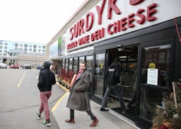 The city of Minneapolis said Tuesday that it has reached a tentative agreement with Surdyk's over its early Sunday opening.