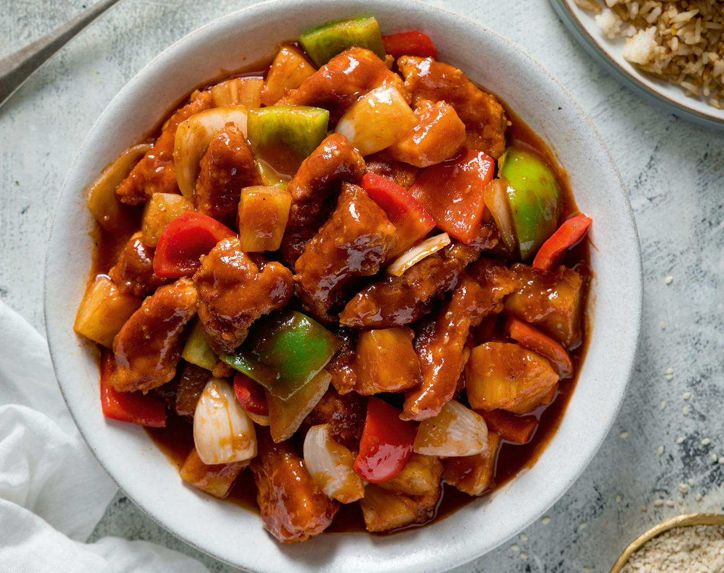 Make takeout-friendly sweet and sour chicken at home with this recipe from "It's All About Dinner" by Nicky Corbishley.