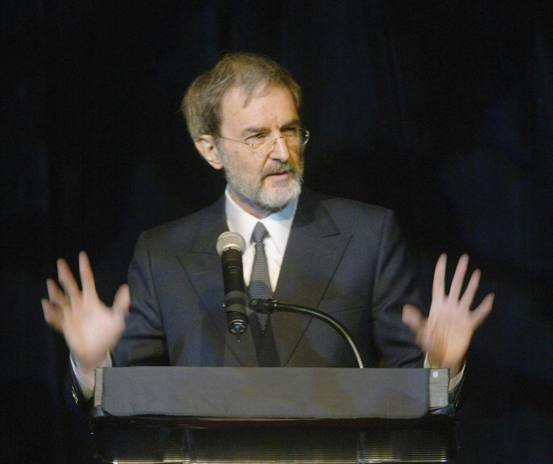 FILE - In a Feb. 5, 2003 file photo, Pulitzer Prize winner and keynote speaker Edmund Morris speaks, during the centennial gala for the Salt River Project at the Arizona Biltmore in Phoenix. Noted presidential biographer Edmund Morris, best known for writing a book about the life of Ronald Reagan in 1999, died Friday, May 25, 2019 in a hospital in Danbury, Connecticut a day after suffering a stroke. He was 78. His wife, Sylvia Jukes Morris, confirmed his death to The Associated Press Monday.