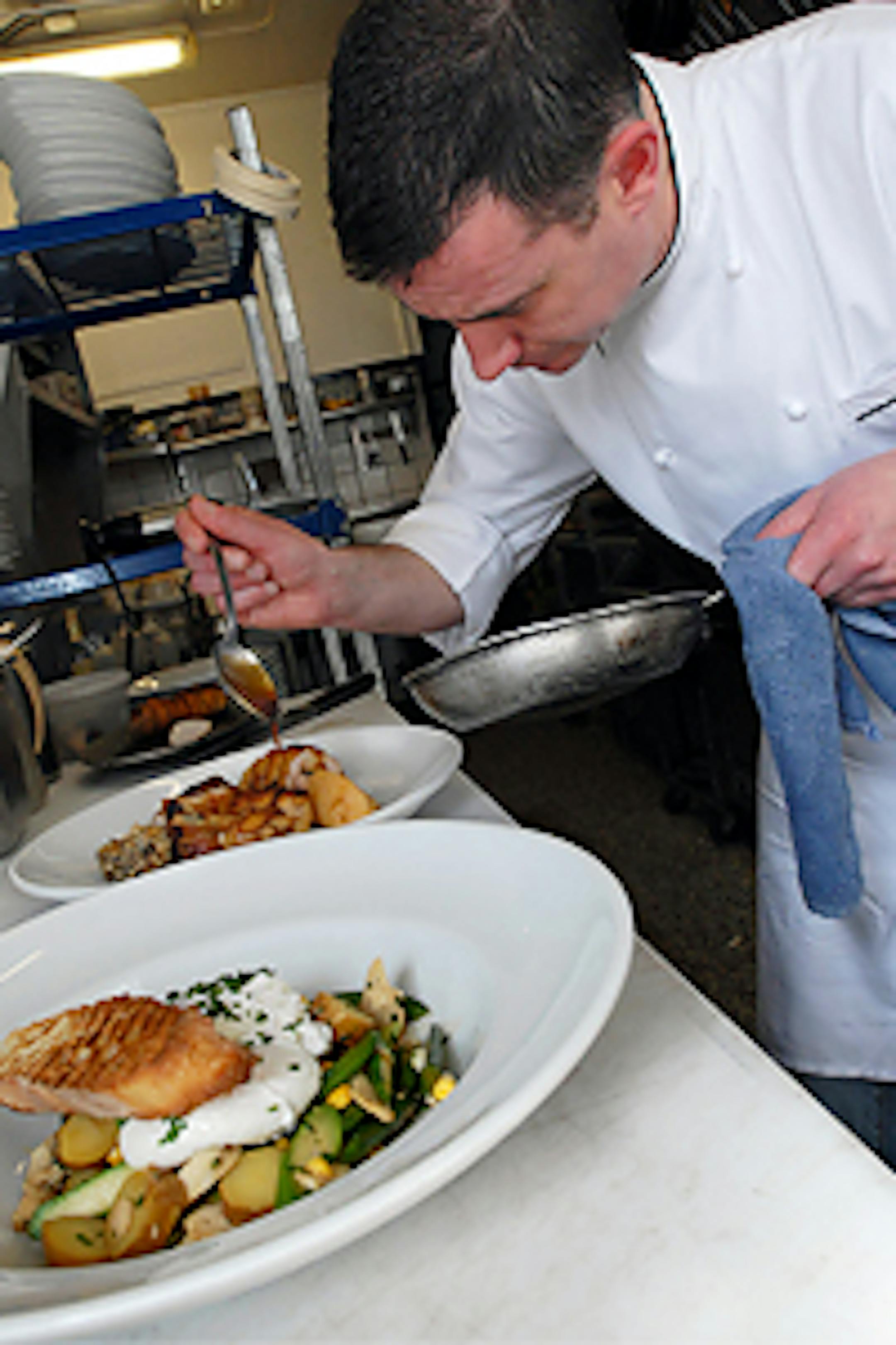 Chef Kevin Kathman prepares the roasted Kadejan chicken