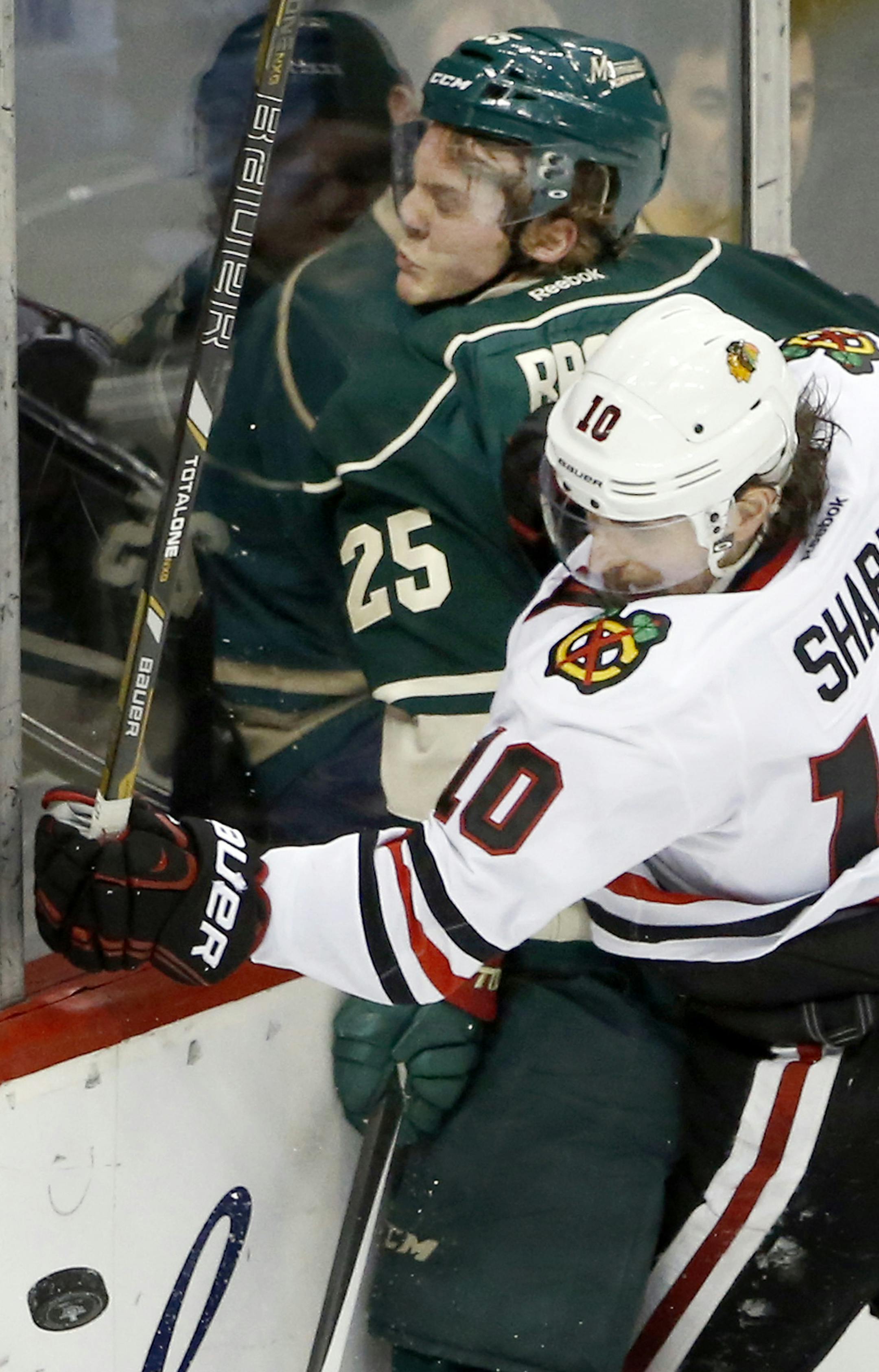 Patrick Sharp (10) checked Jonas Brodin (25) in the first period. ] CARLOS GONZALEZ cgonzalez@startribune.com - May 9, 2014, St. Paul, Minn., Xcel Energy Center, NHL, Minnesota Wild vs. Chicago Blackhawks, Stanley Cup Playoffs Round 2, Game 4