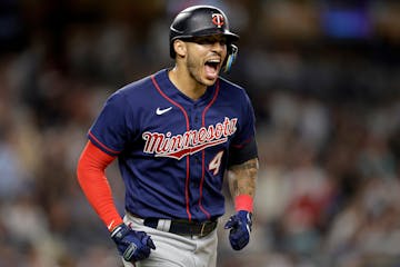 Carlos Correa reacts after hitting a two-run home run against the New York Yankees during the eighth inning Thursday